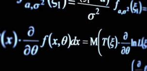 photograph of scientific equations on a blackboard